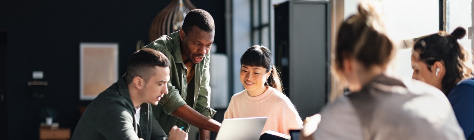 Diverse Team Working Together in Modern Co Working Space